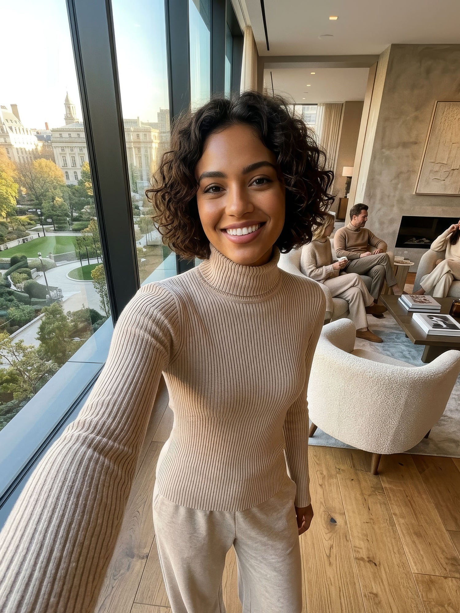Woman taking a selfie in a modern living wearing the Meadow Lounge outfit.